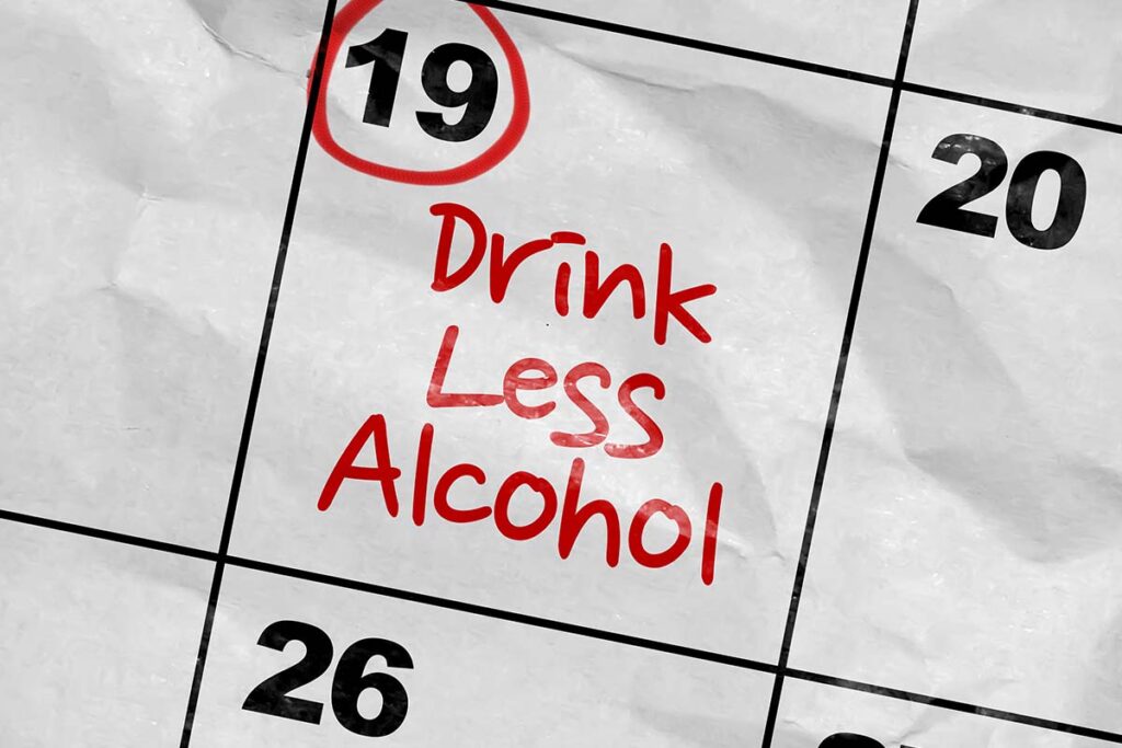 close up of the 19th on a calendar with drink less alcohol reminder circled