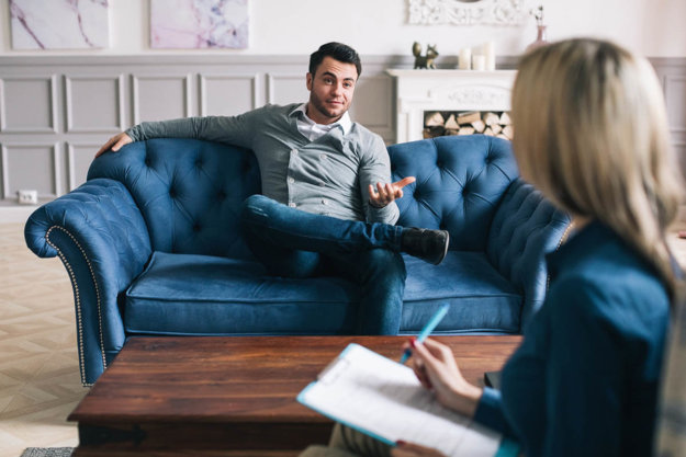 How Long Does IOP Last_ Patient sits on couch, asking how long an IOP lasts