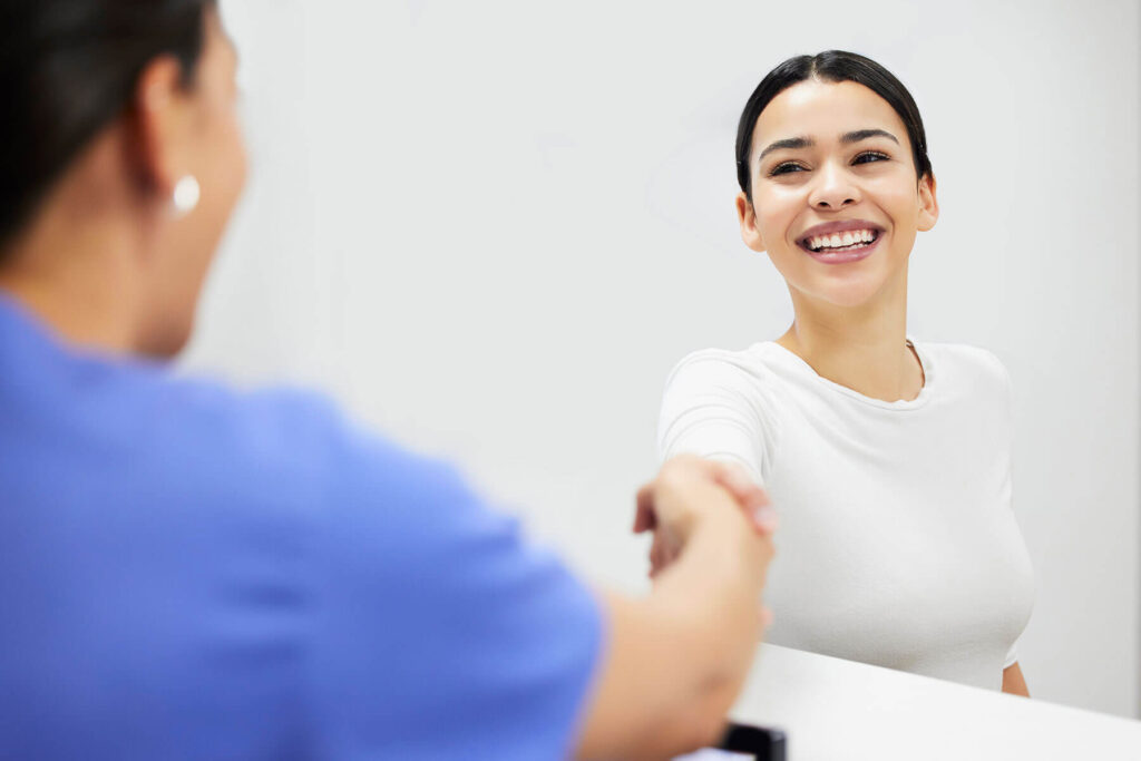 smiling person enrolling in intensive outpatient program near Aldie VA