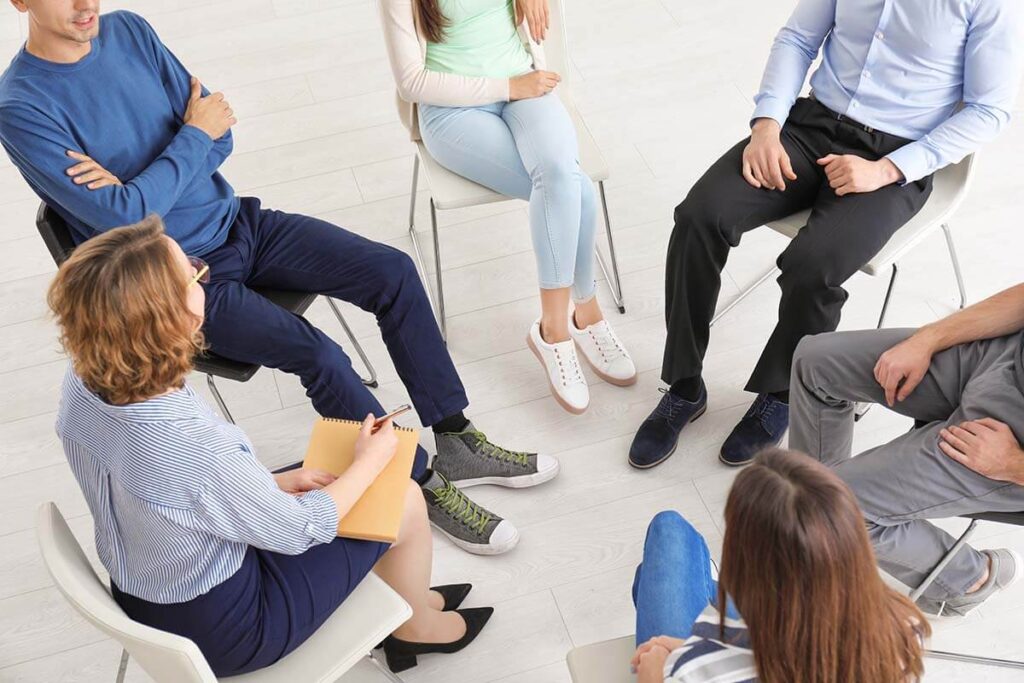 people in group therapy learning the 12 steps simplified