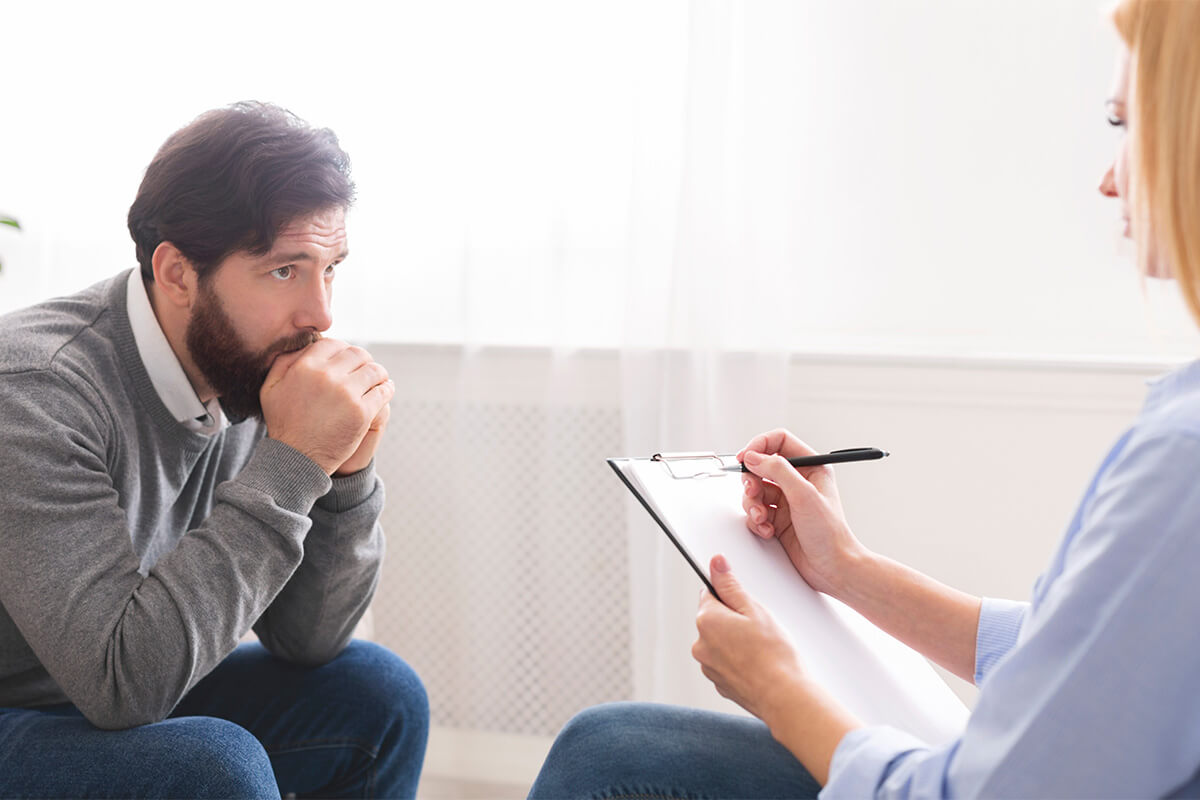 clinician helping client plan home support for recovery