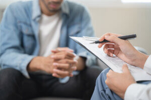 person doing intake while learning about alcohol rehab costs in virginia