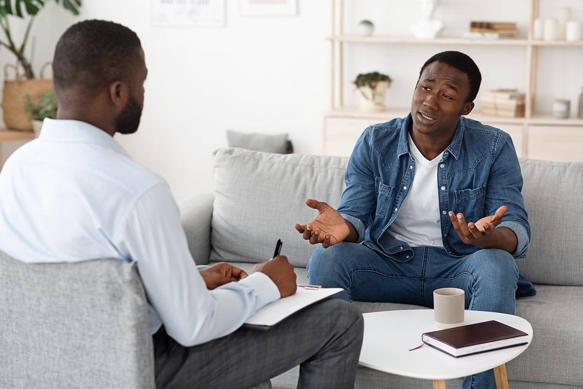 Is Harm Reduction Effective for All Types of Addiction person in counseling learning about harm reduction for addiction